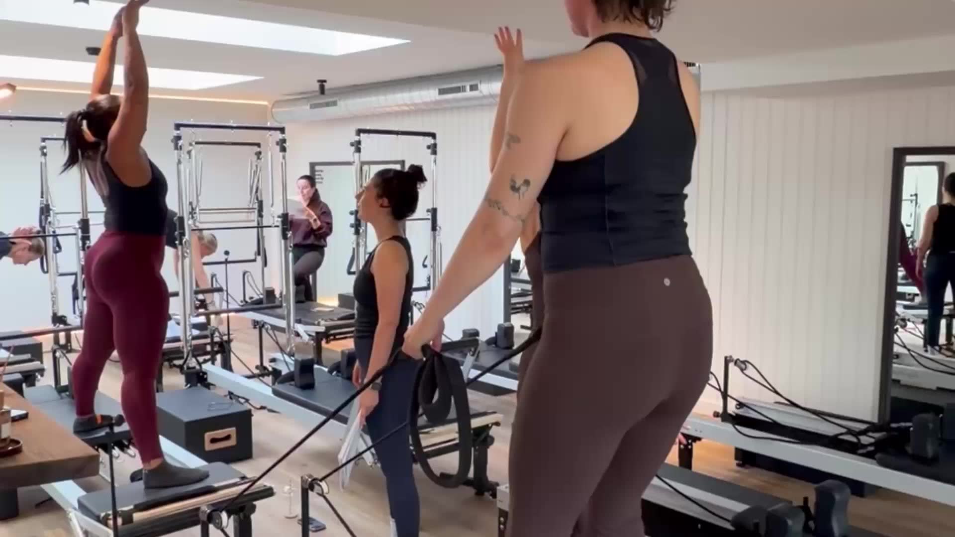Teachers practising advanced Reformer repertoire with a trainer at the Altrincham training centre